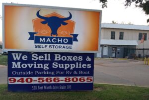 Macho storage denton storage sign in front of main entrance to storage facility