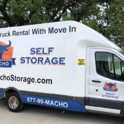 macho self storage truck with free use of moving truck sign on side of van