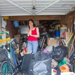 woman organizing clutter for storage unit