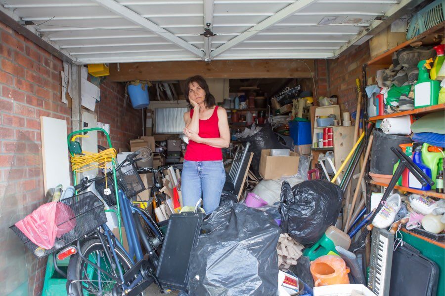 woman organizing clutter for storage unit