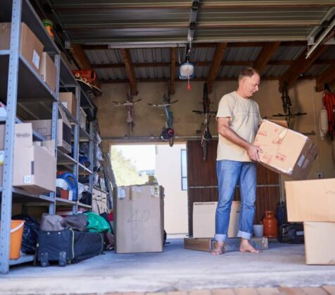 man putting items into a self storage unit in Dallas