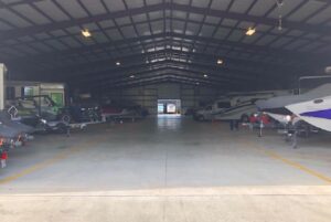 boats and rv's parked inside a storage faciltiy