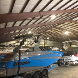 A boat being stored indoors for the winter