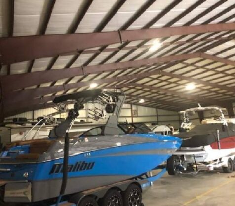 A boat being stored indoors for the winter