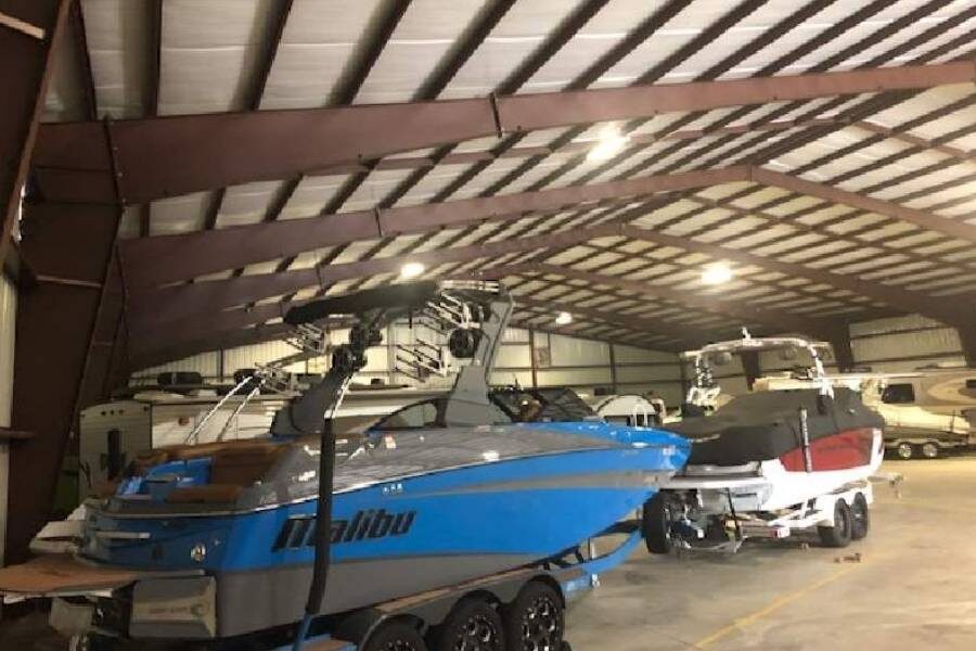 A boat being stored indoors for the winter