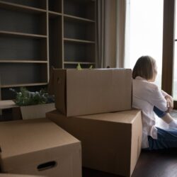 woman preparing boxes for storage