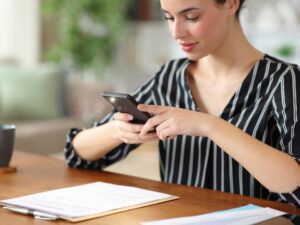 woman taking photos of documents to be placed into Dallas storage facility